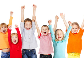Happiness group children with their hands up isolated on white