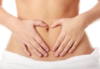 Hand on belly isolated on white background