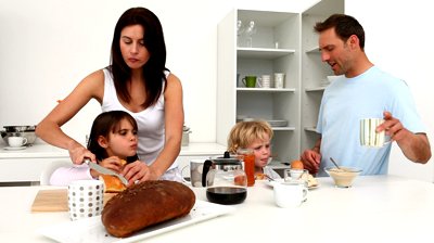 stock-footage-family-having-breakfast-together-in-the-kitchen-at-home