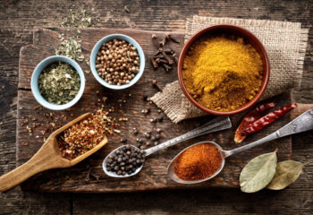 various spices on old wooden table