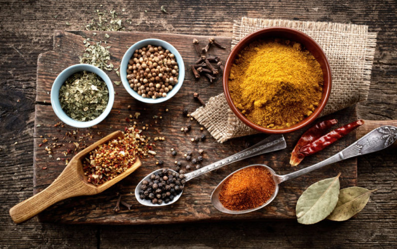 various spices on old wooden table